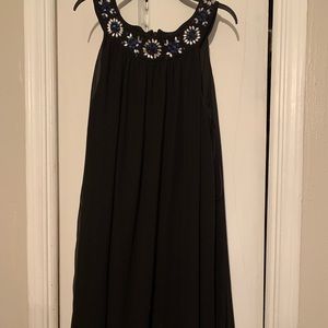 Nice black dress it has a sheer layer on top